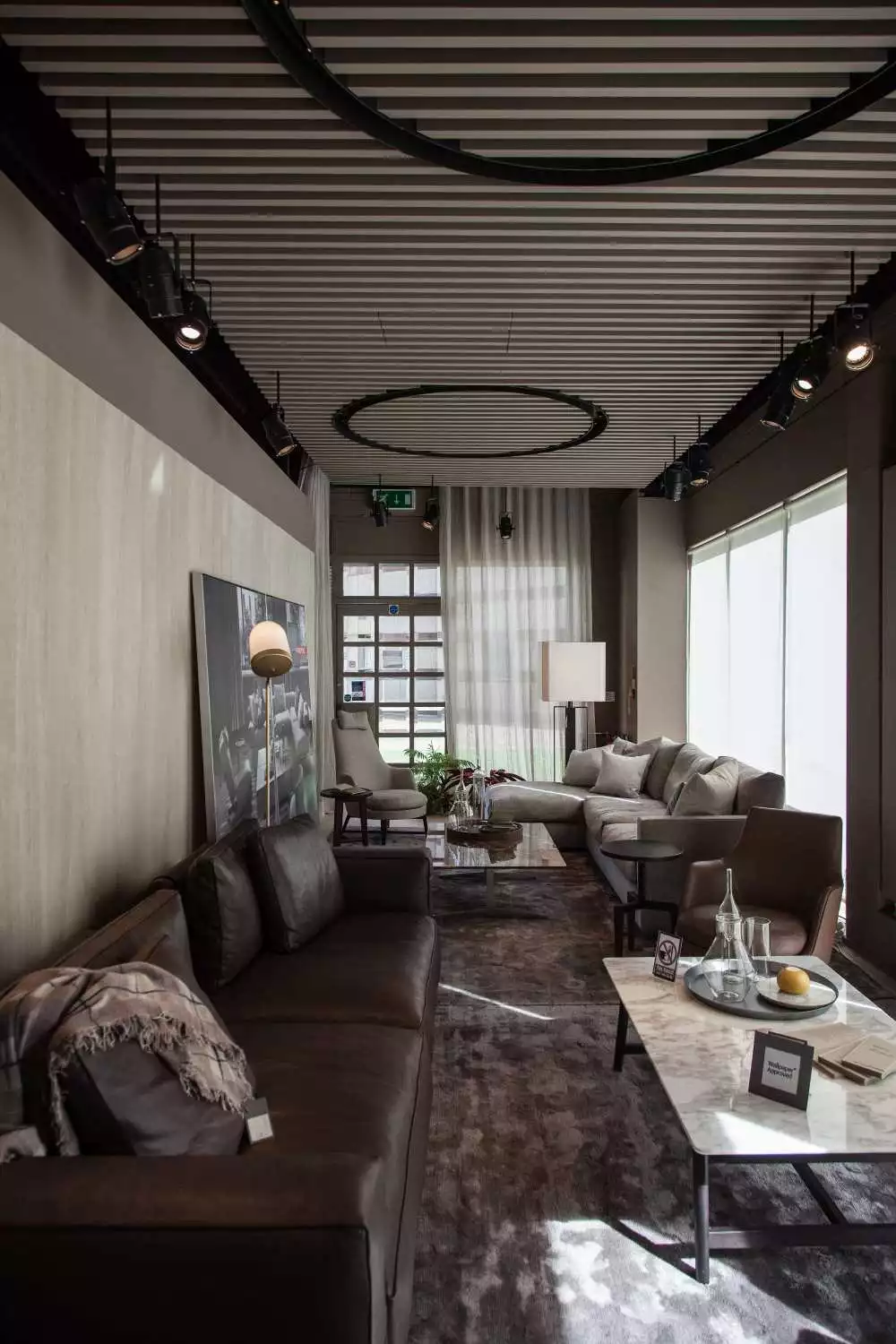 The two sofas in this long and narrow living room are placed against opposite walls