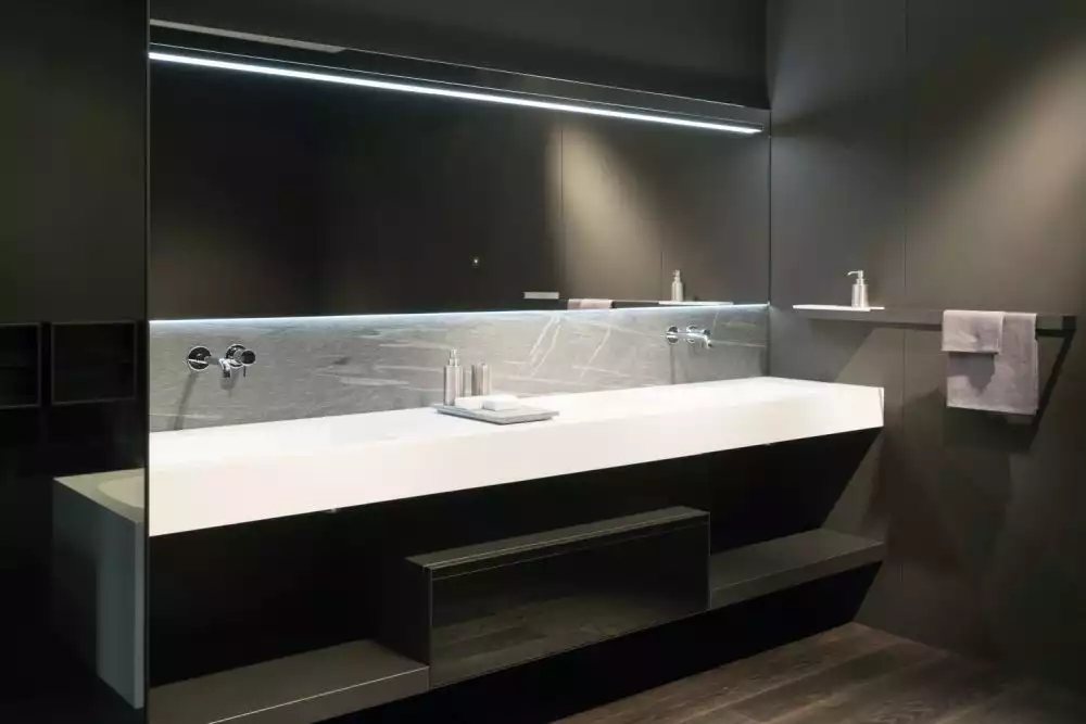 Minimalist bathroom with large mirror and double vanity