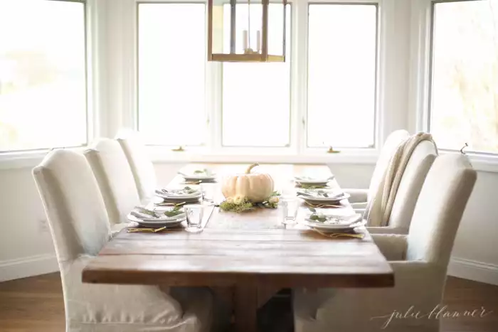 Neutral dining decorated for fall