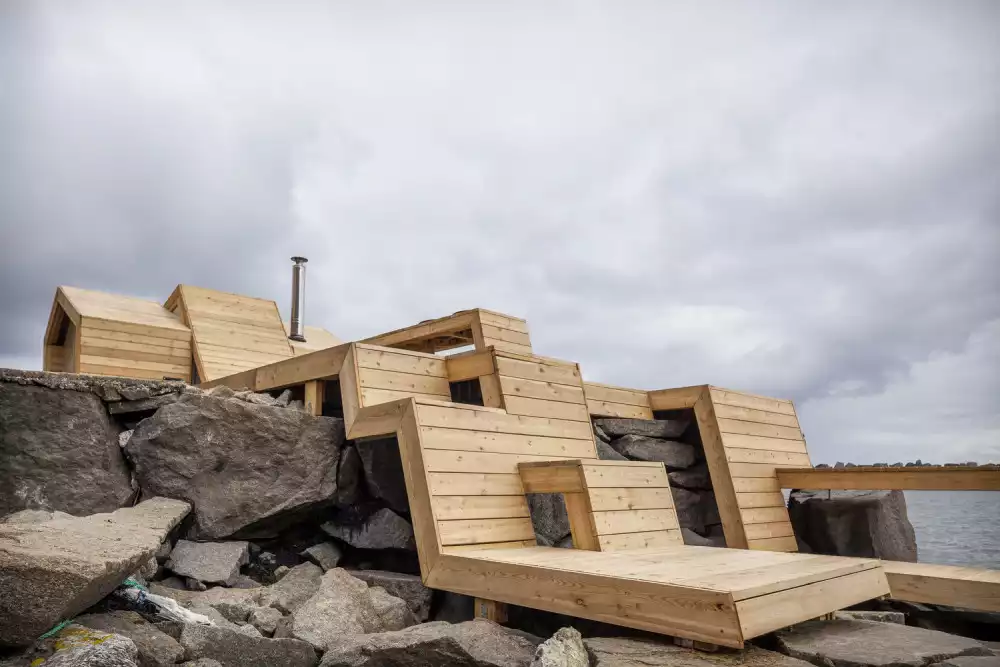 Student Build Design In Norway wood shell on rocks