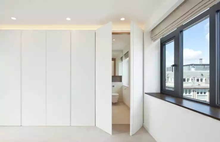 Toilet hidden behid doors