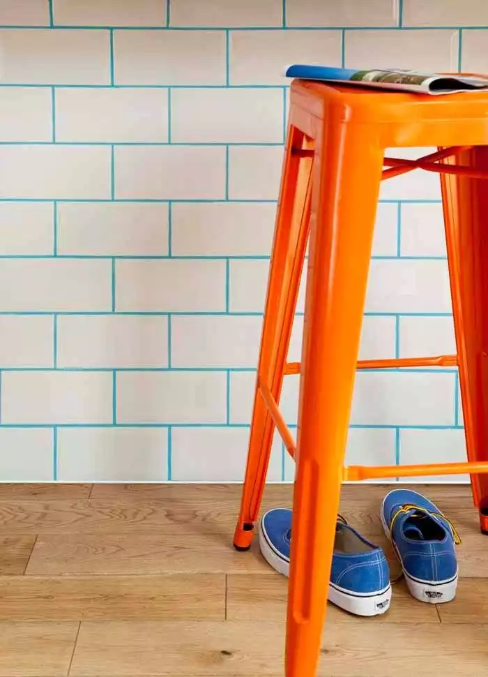 White subway tiles with turquouise grout