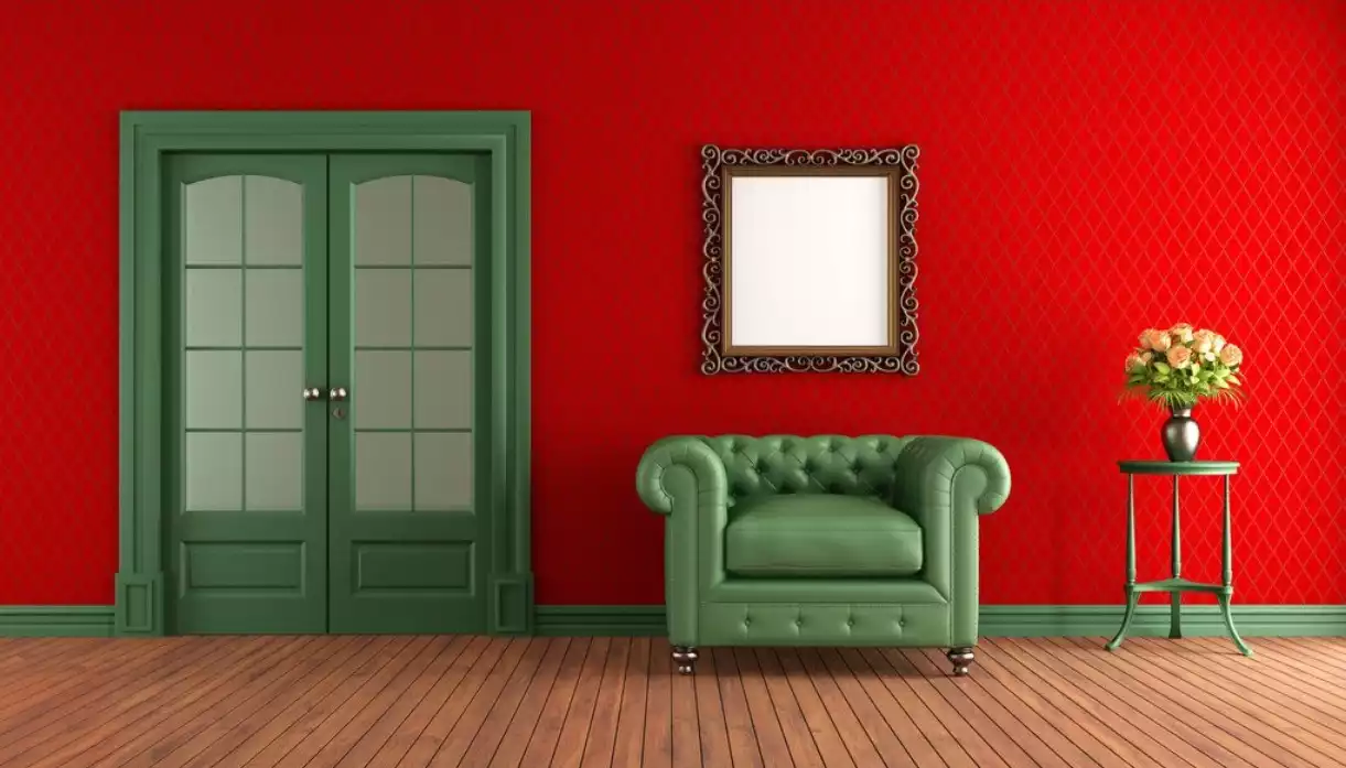 red-walls-green-armchair-in-living-room