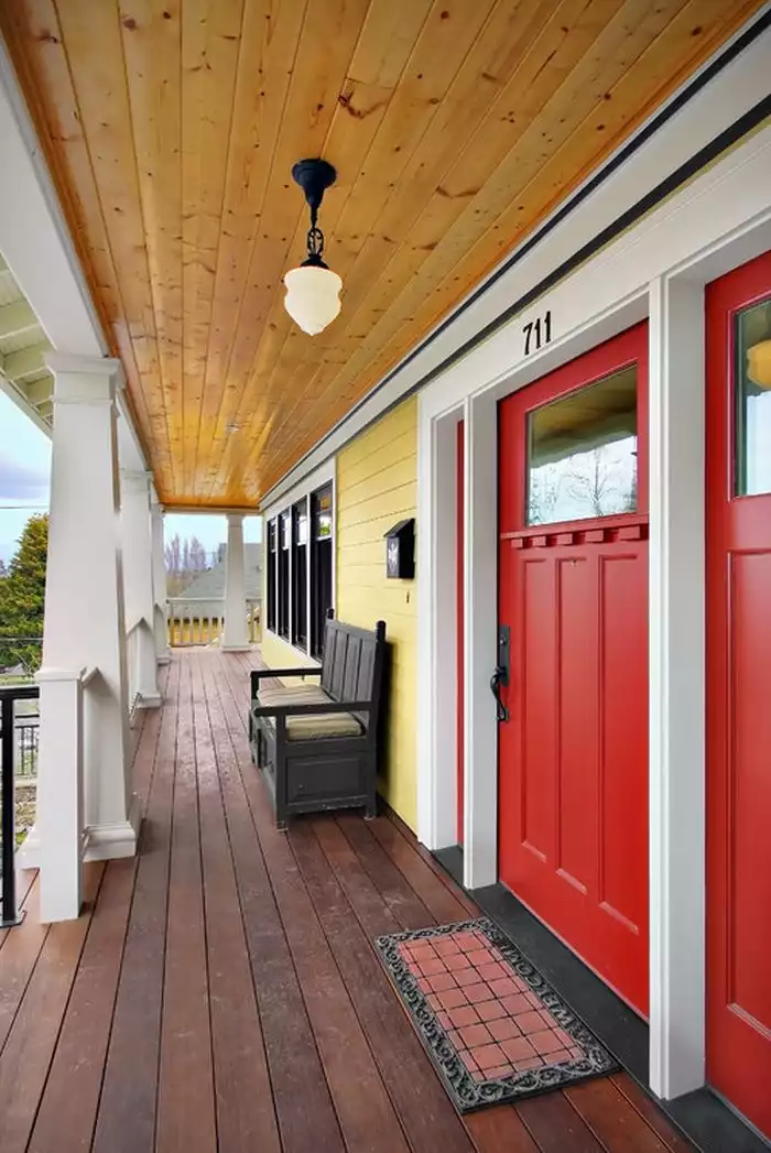 yellow-house-facade-with-red-front-doors