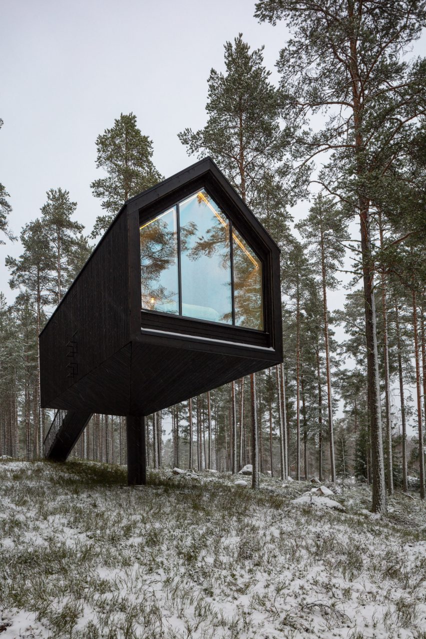 A cabin perched on a single column cantilever