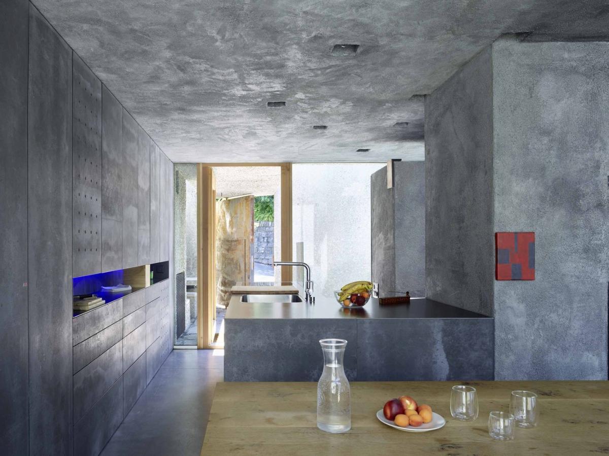 A concrete house with lush surroundings kitchen