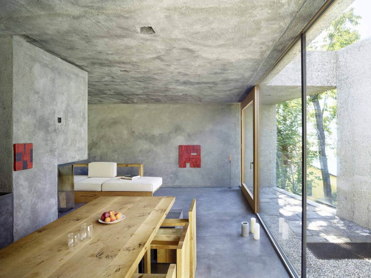 A concrete house with lush surroundings living