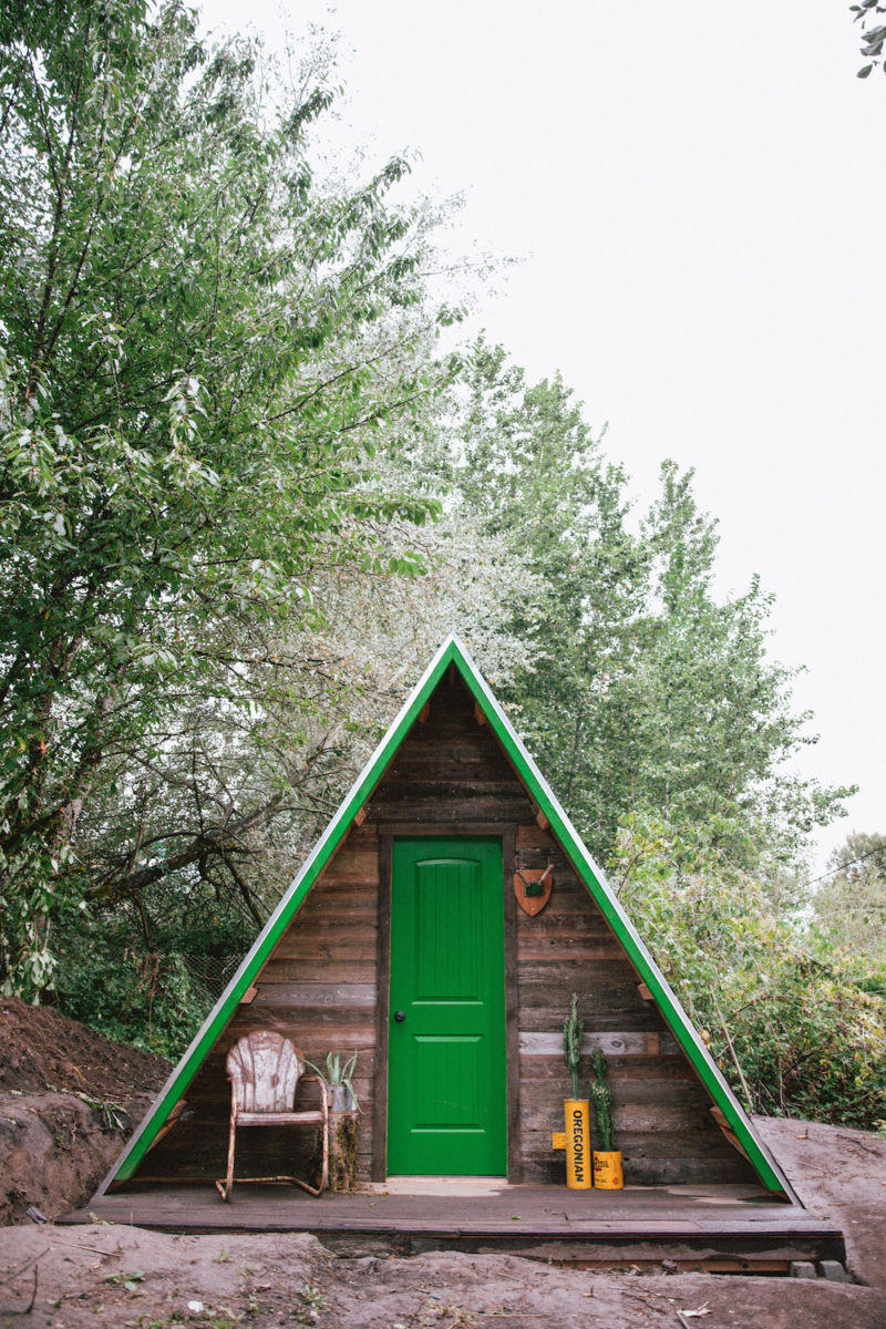 A frame cabin bright front door