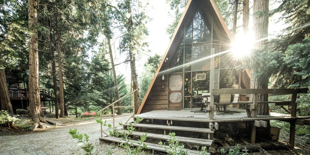 A frame cabin screened windows