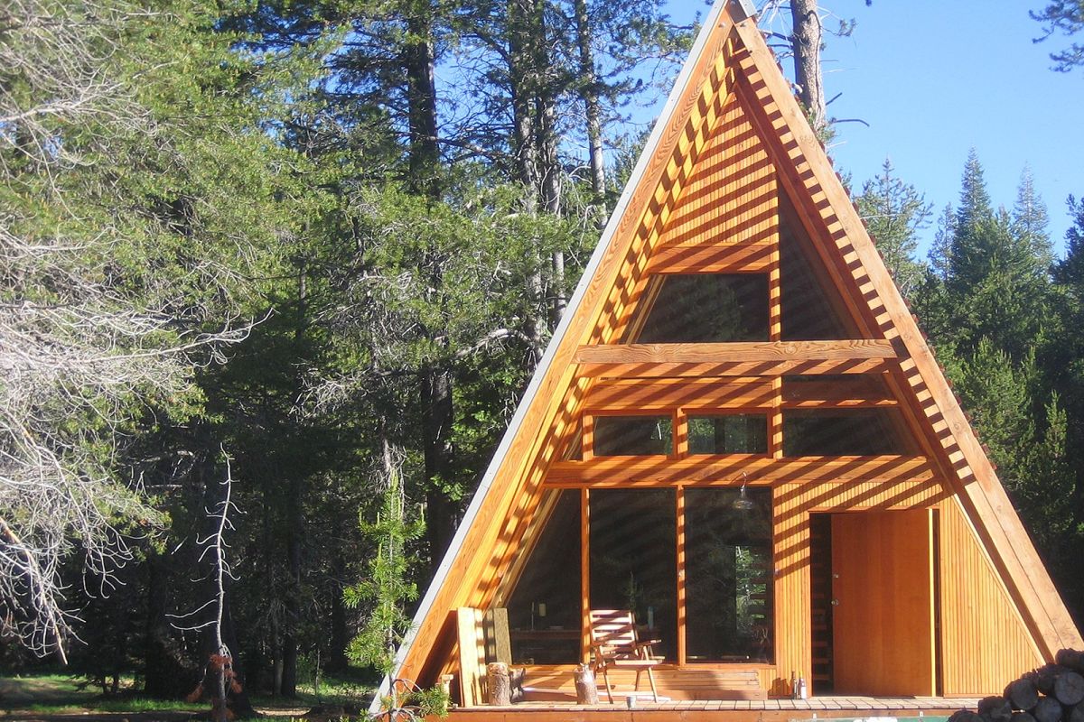 A frame cabin slatted porch roof