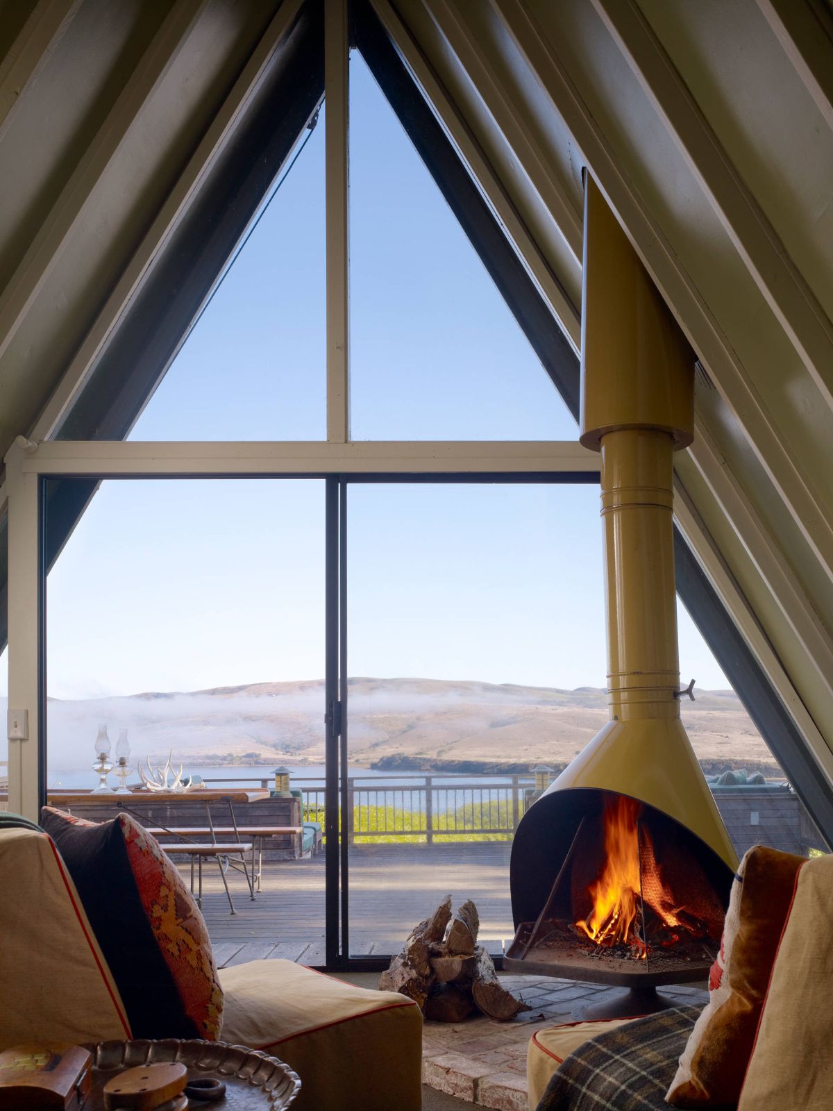 A frame cabin with a beautiful lake view