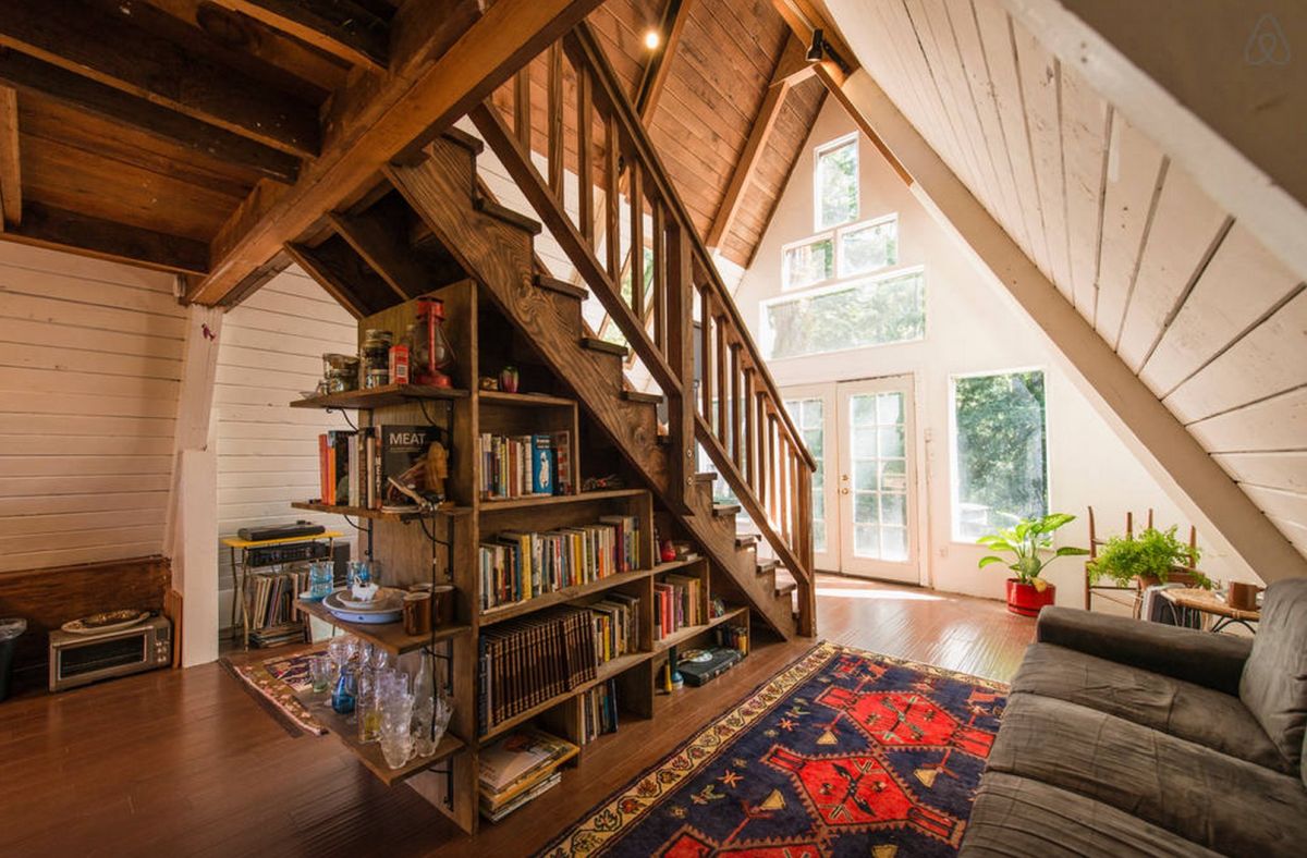 A frame cabin with storage understairs