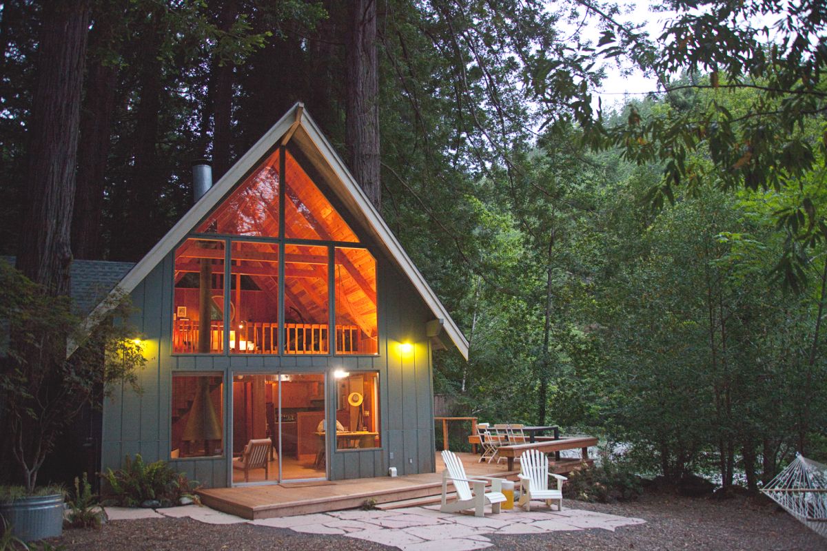 A frame cabin wood stone patio