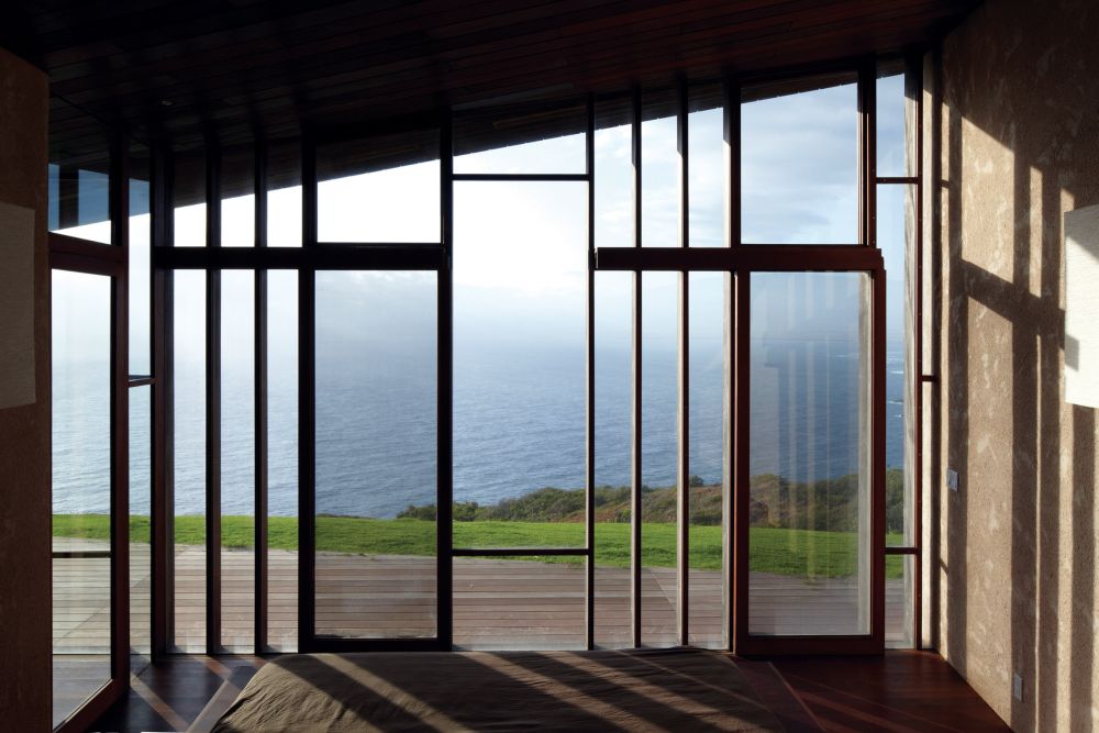 A house with angular roofs by Dekleva Gregoric Arhitekti bedroom