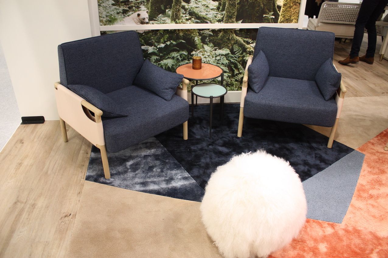Add a furry round ottoman to insert playfulness into the setting.