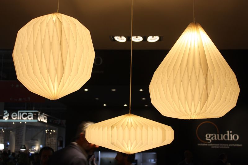 A closer look reveals the accordion folds of these pendant fixtures.