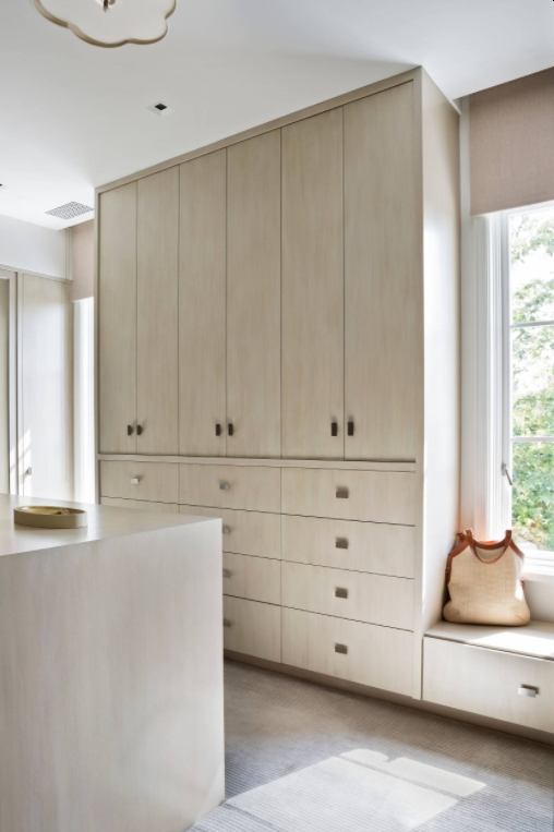 walk-in wardrobe with cabinets and drawers