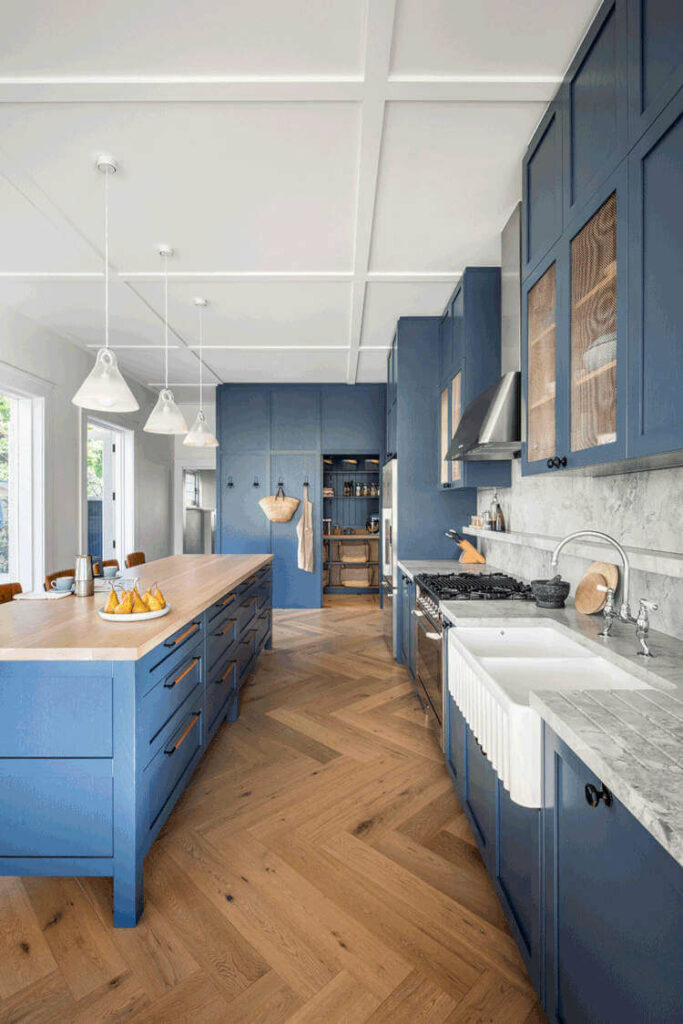 A farmhouse blue kitchen cabinets