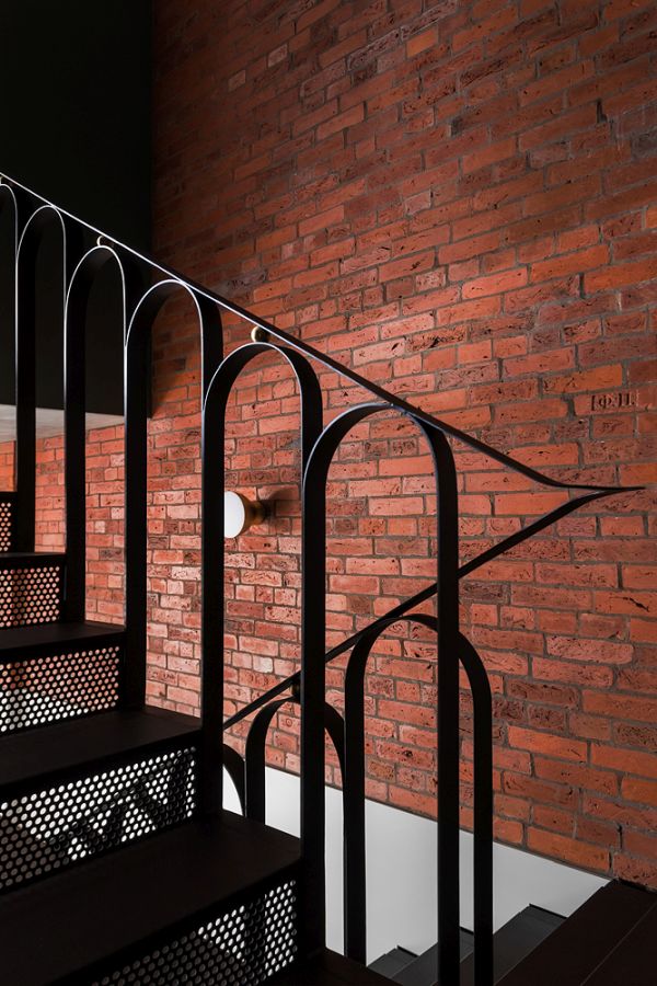 All black staircase with curved railings