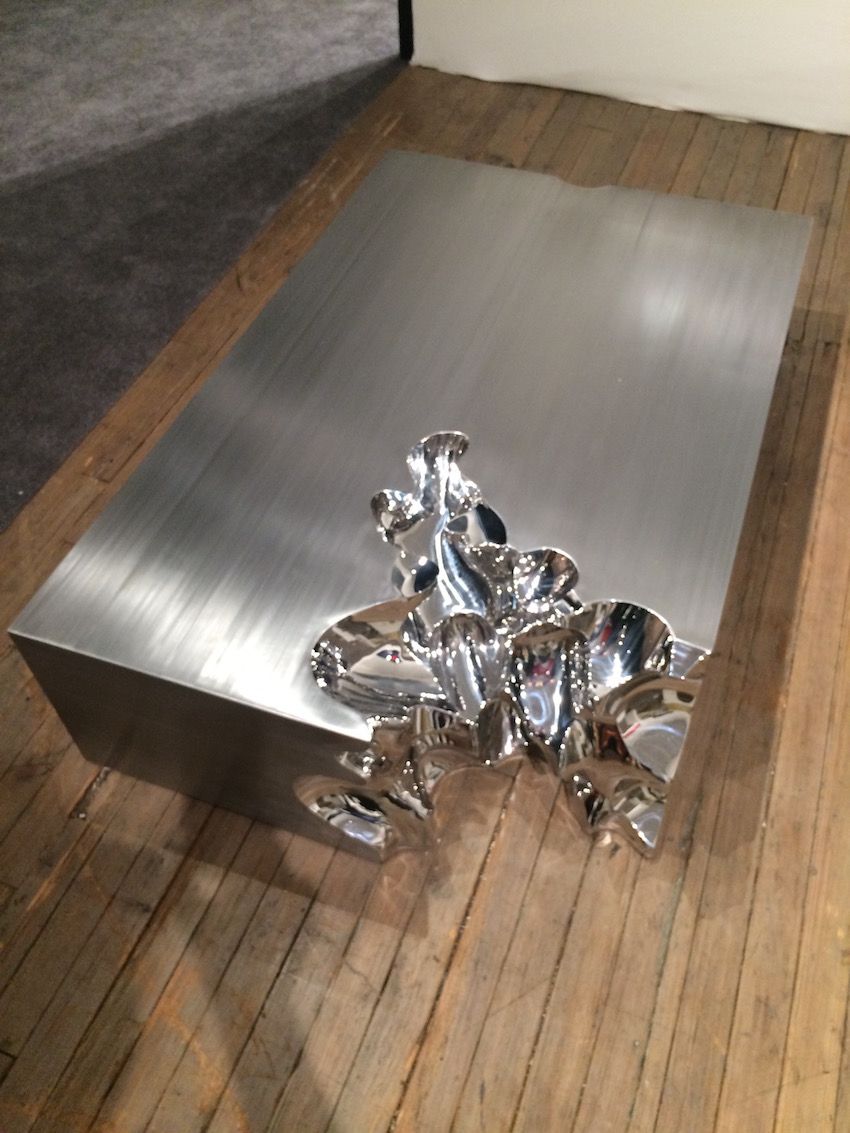 Titled Gold Brick NO. 1, the table is made from stainless steel.