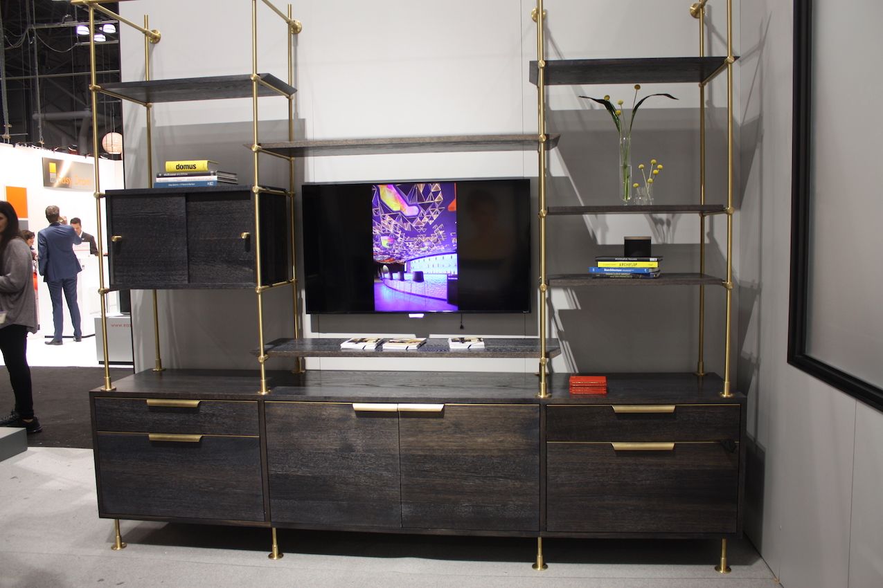 A bookshelf can have multiple uses, including as an entertainment center.