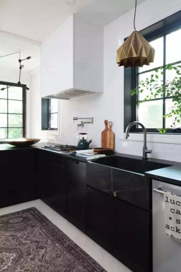 An eclectic black and white kitchen