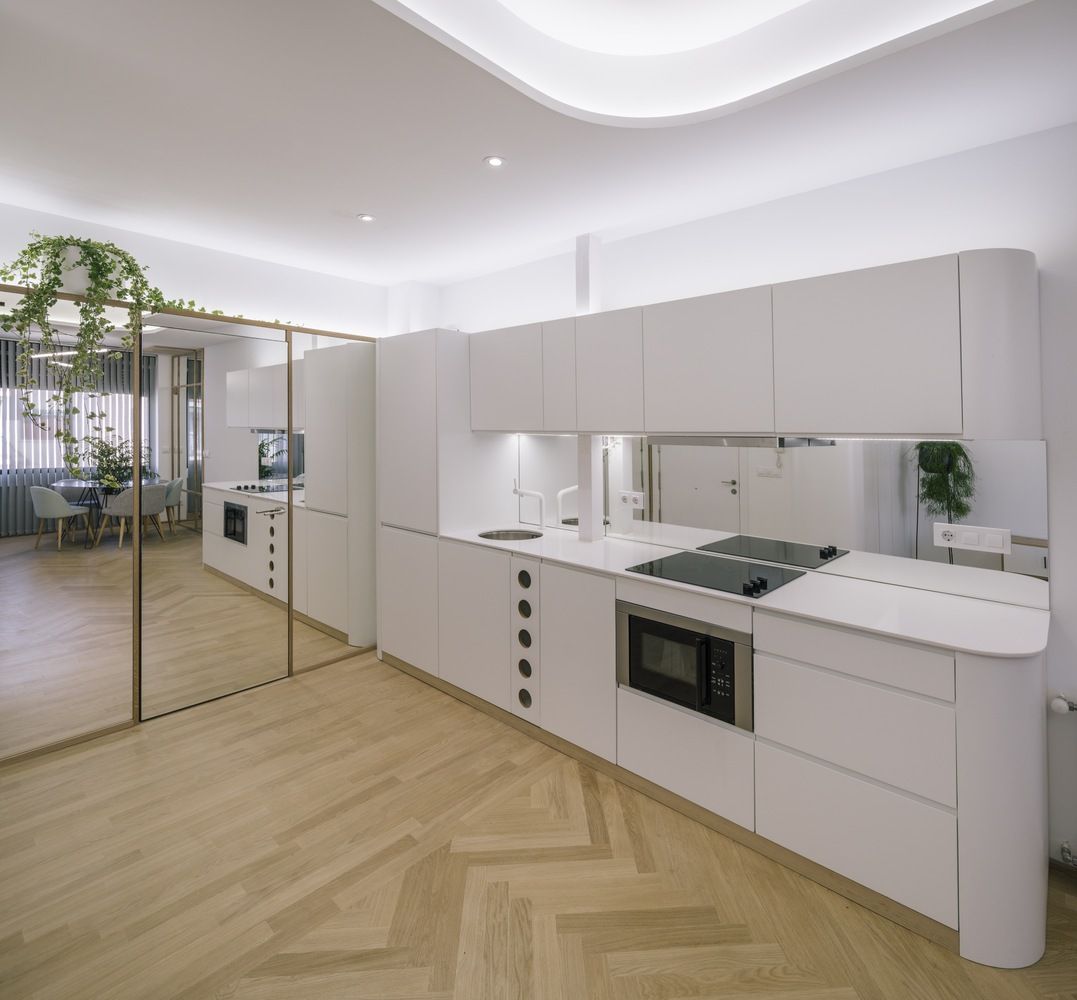 Another cove in the ceiling helps open up the space in the kitchen area.