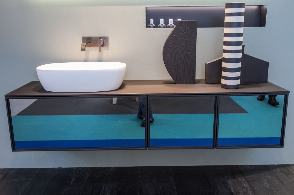 The more traditional style of floating vanity has a mirrored front.