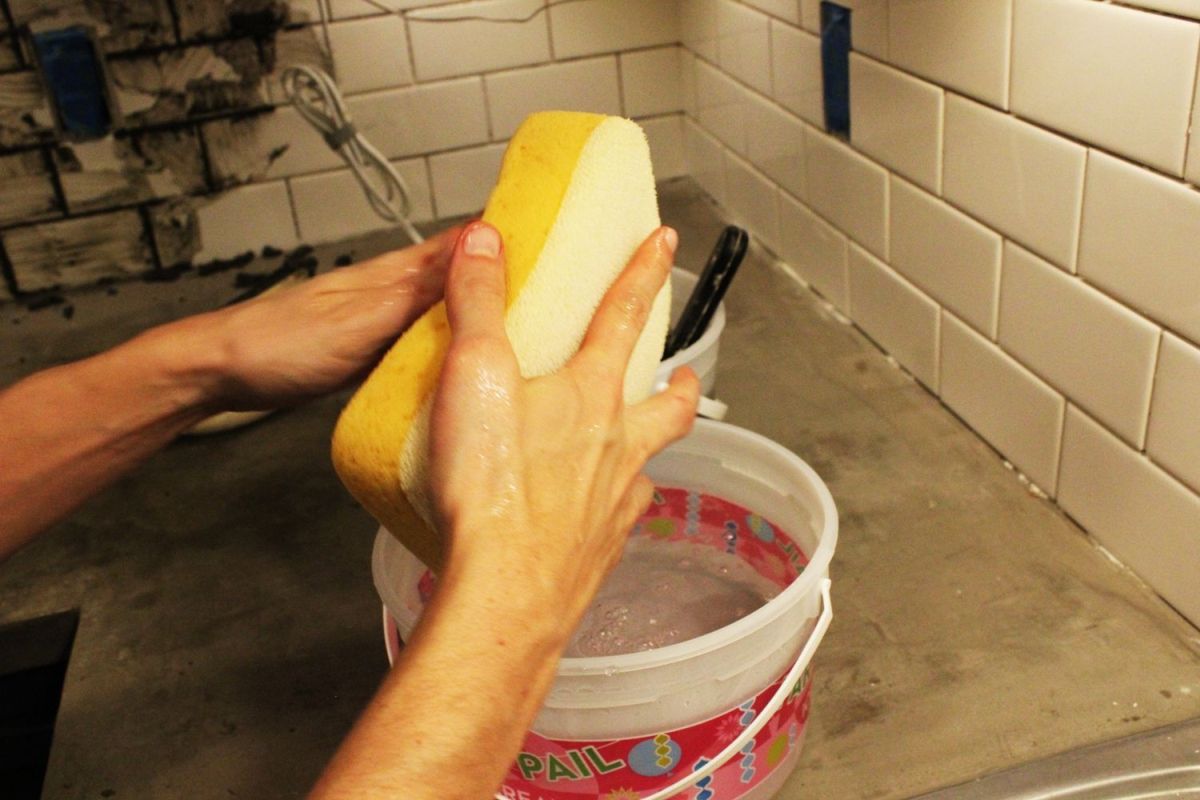 Apply grout on all tiles