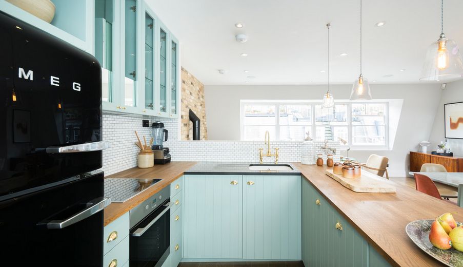 Aqua kitchen design with black SMEG fridge