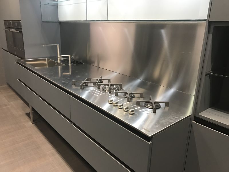 Aran kitchen with stainless steel countertop and backsplash