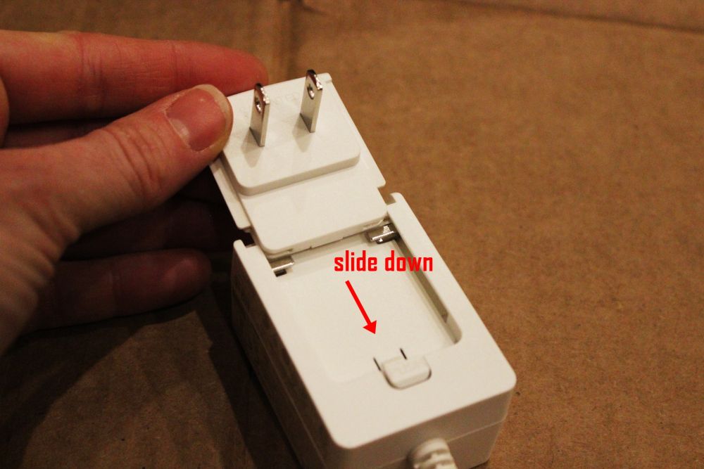 Assemble the power adapter by sliding the plug down into its case