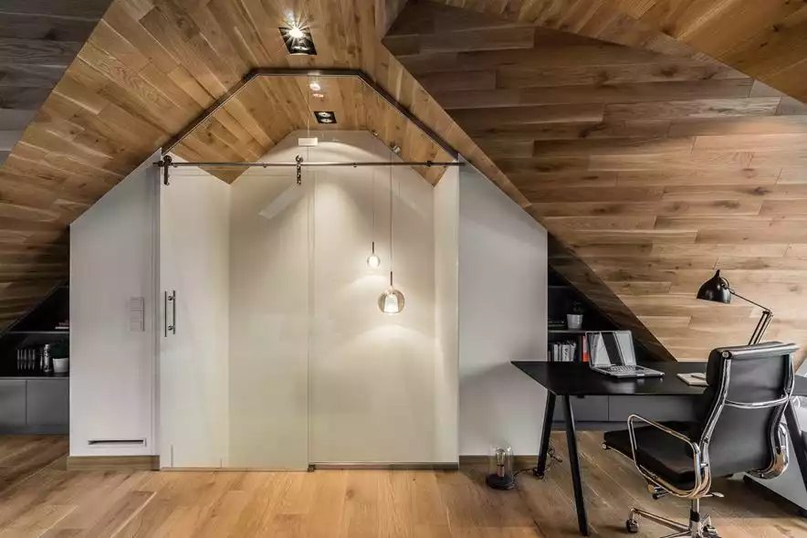 Attic office design with wooden ceilings