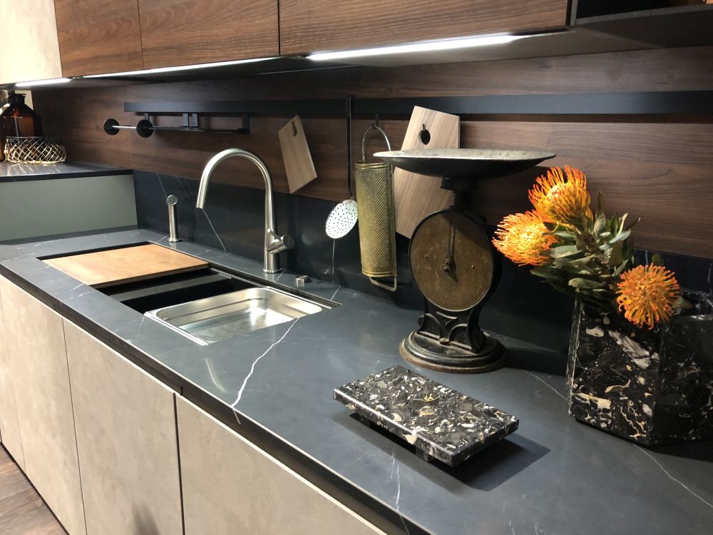 Backsplash storage and black kitchen countertop