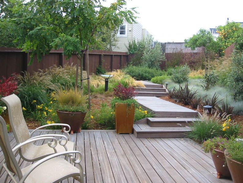 Backyard deck with pathway through garden