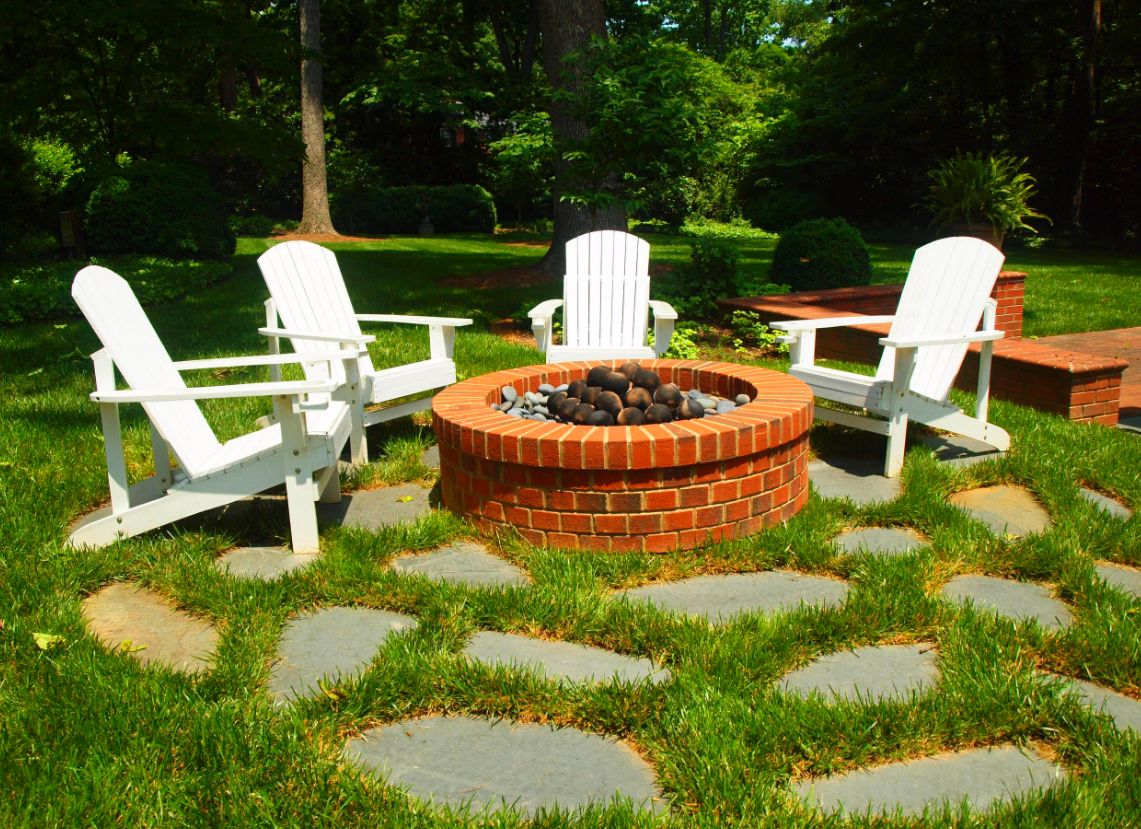 Backyard flagstone patio and fire pit seating