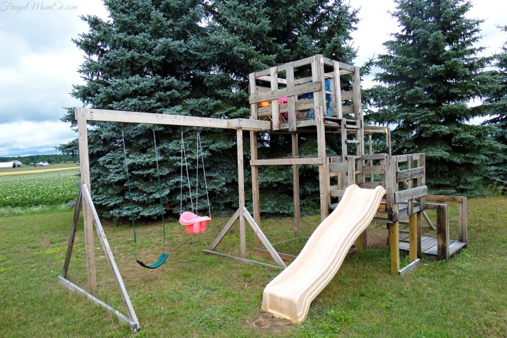 Backyard swing set and playhouse