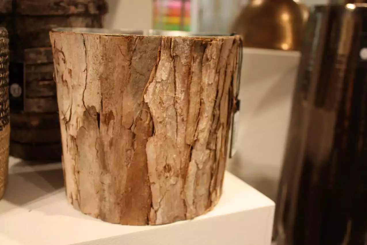 A bark-covered bucket is perfect for plants or storage.