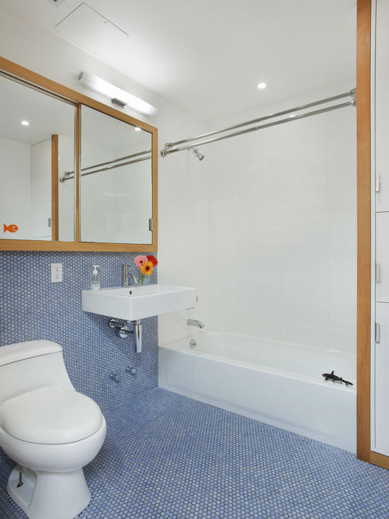 Bathroom floor and half wall with penny tiles