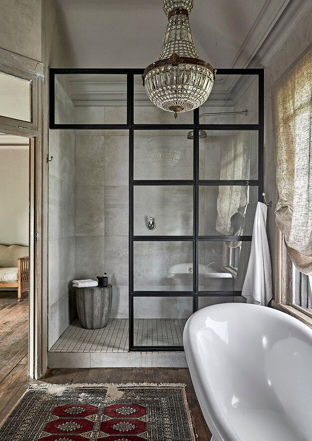 Bathroom with black framed shower