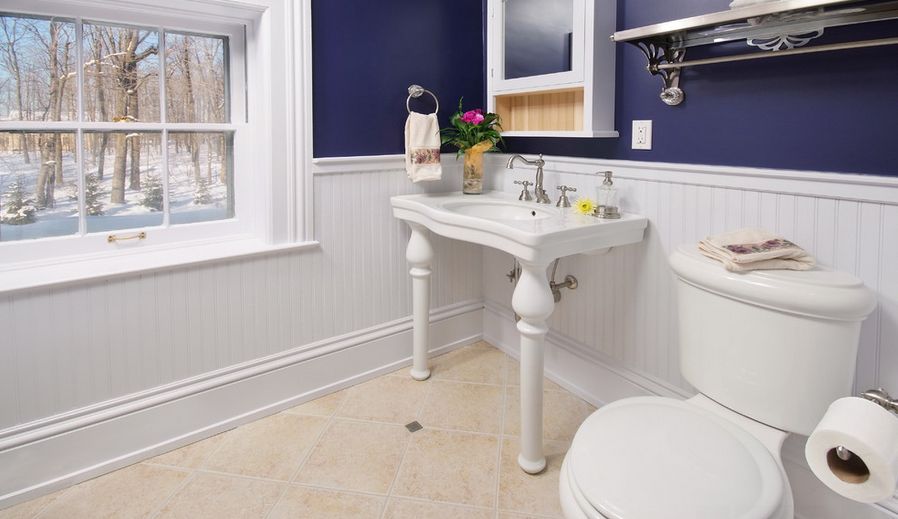 Bathroom with half white and indigo walls