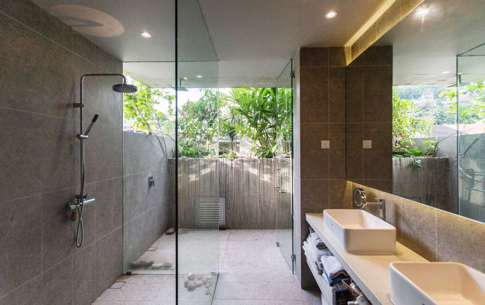 Bathroom with walk in shower double vanity and open to outdoor