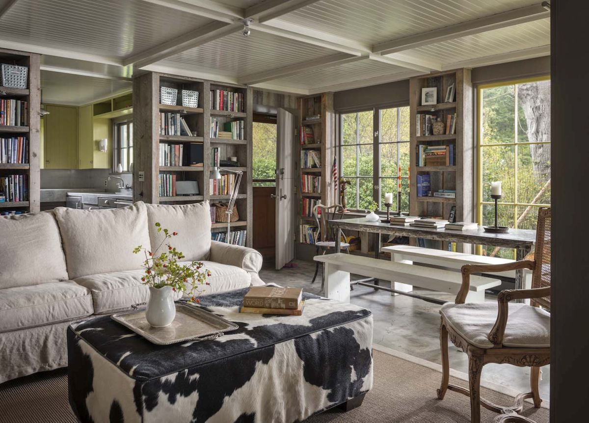 Beach cabin living room with cowhide ottoman