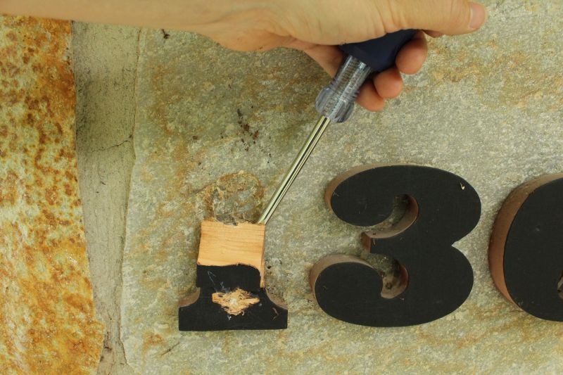 Begin by removing your old house numbers