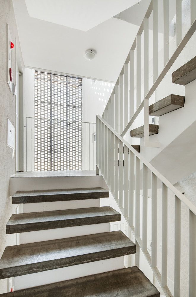 Beyond the Screen brick facade - OBBA - staircase