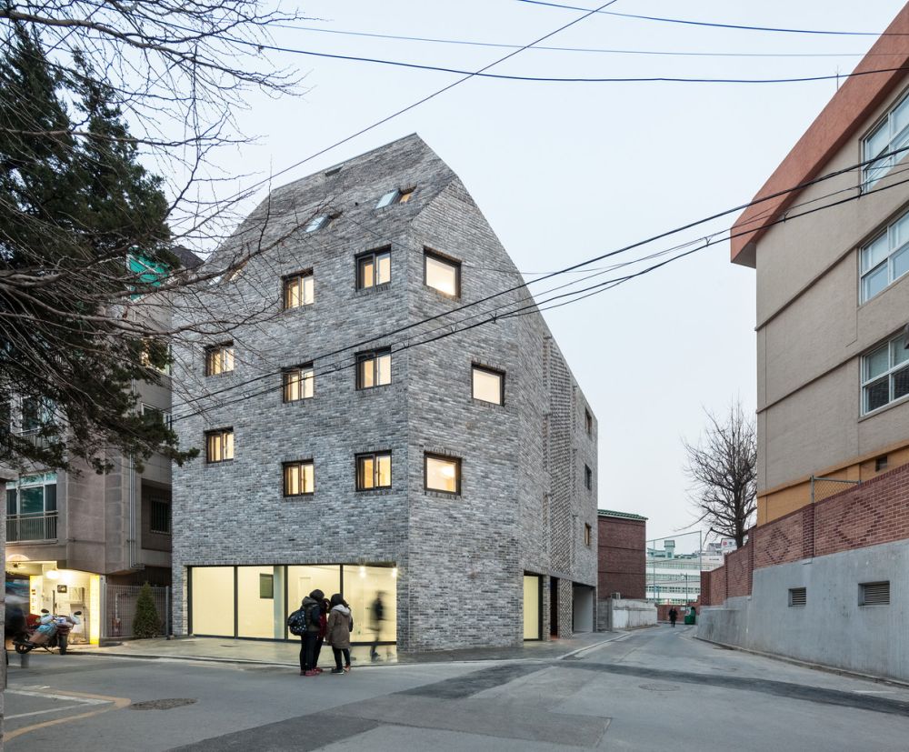 Beyond the Screen brick facade - OBBA