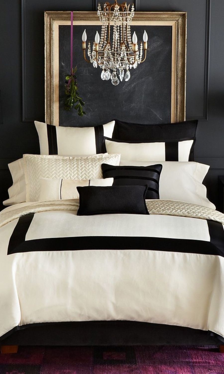 Black and gold bedroom decor with a large emptu frame headboard