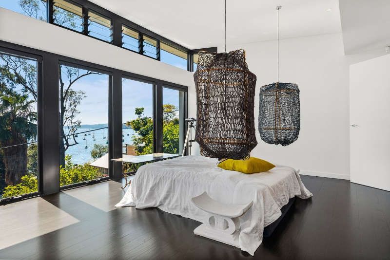 Black and white bedroom with harbour view