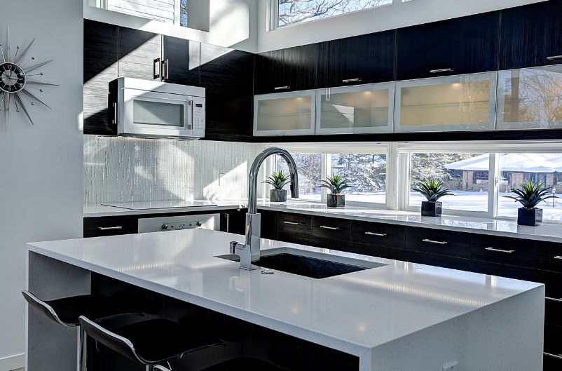 Black and white kitchen wind small window above top