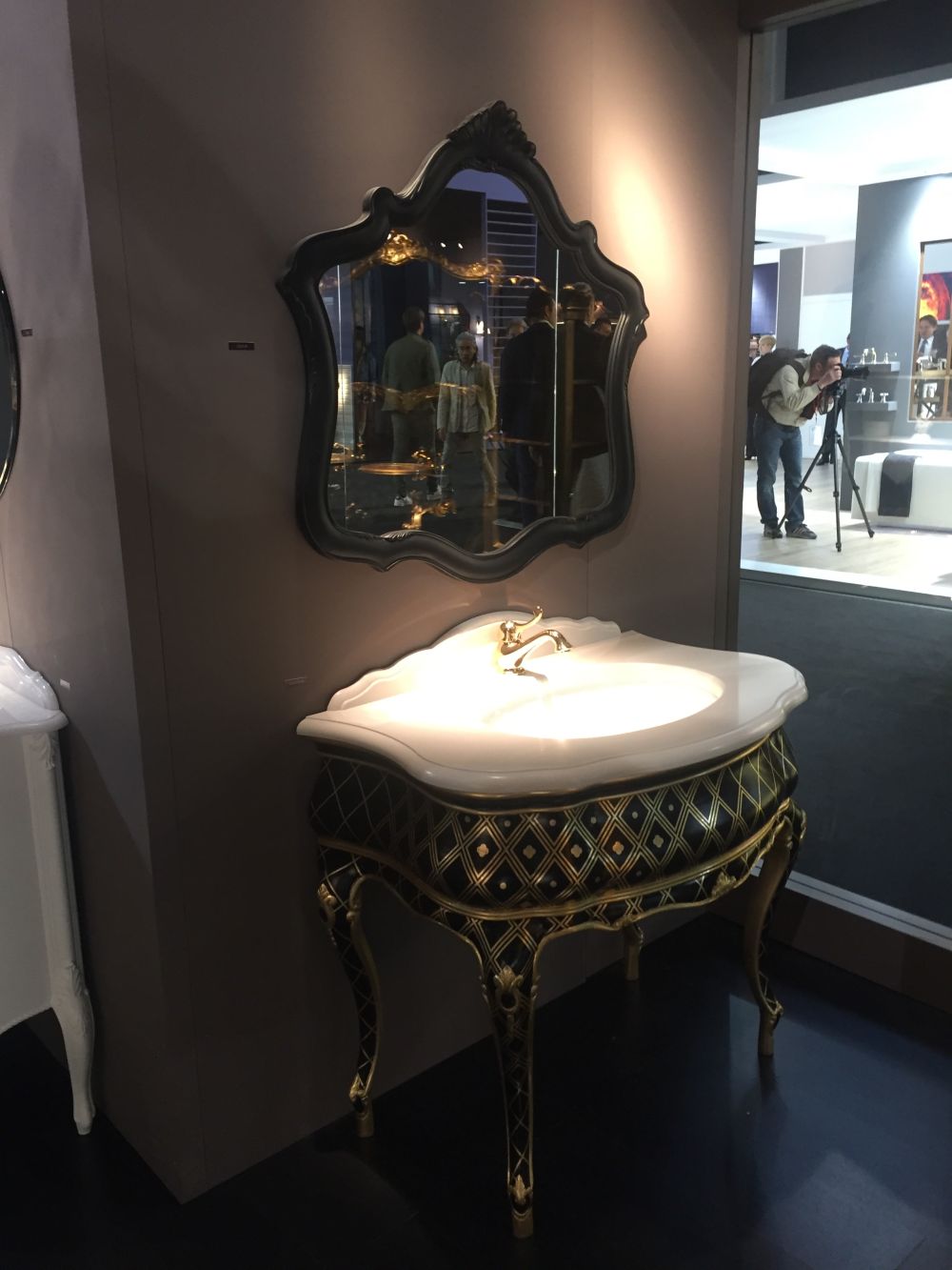 Black bathroom vanity with touches of gold